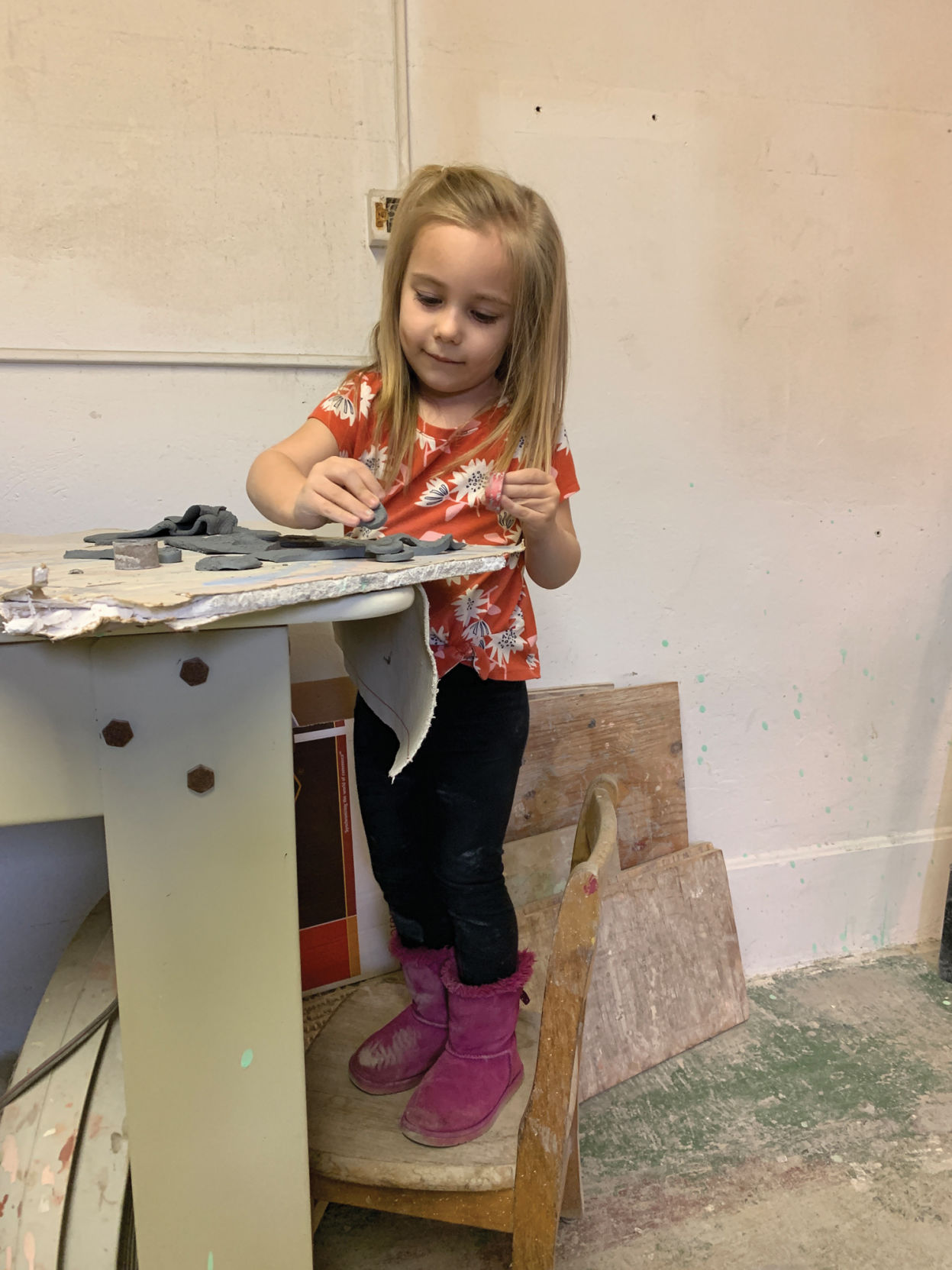 Girl sculpting at Koch Ceramics